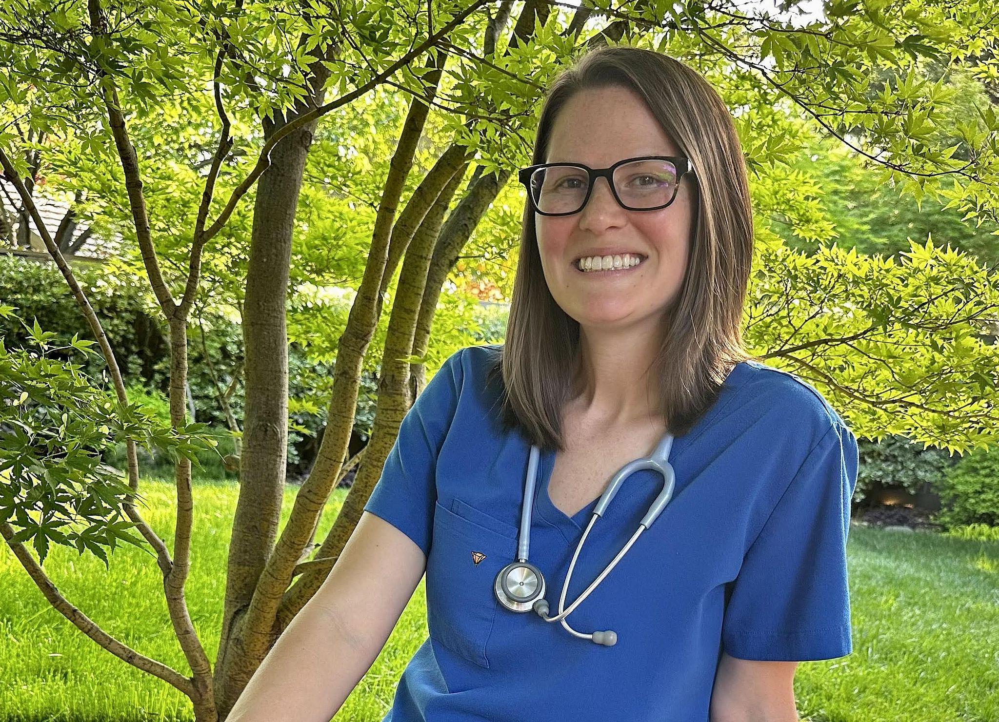 Portrait of Janelle Heisler in scrubs with stethoscope